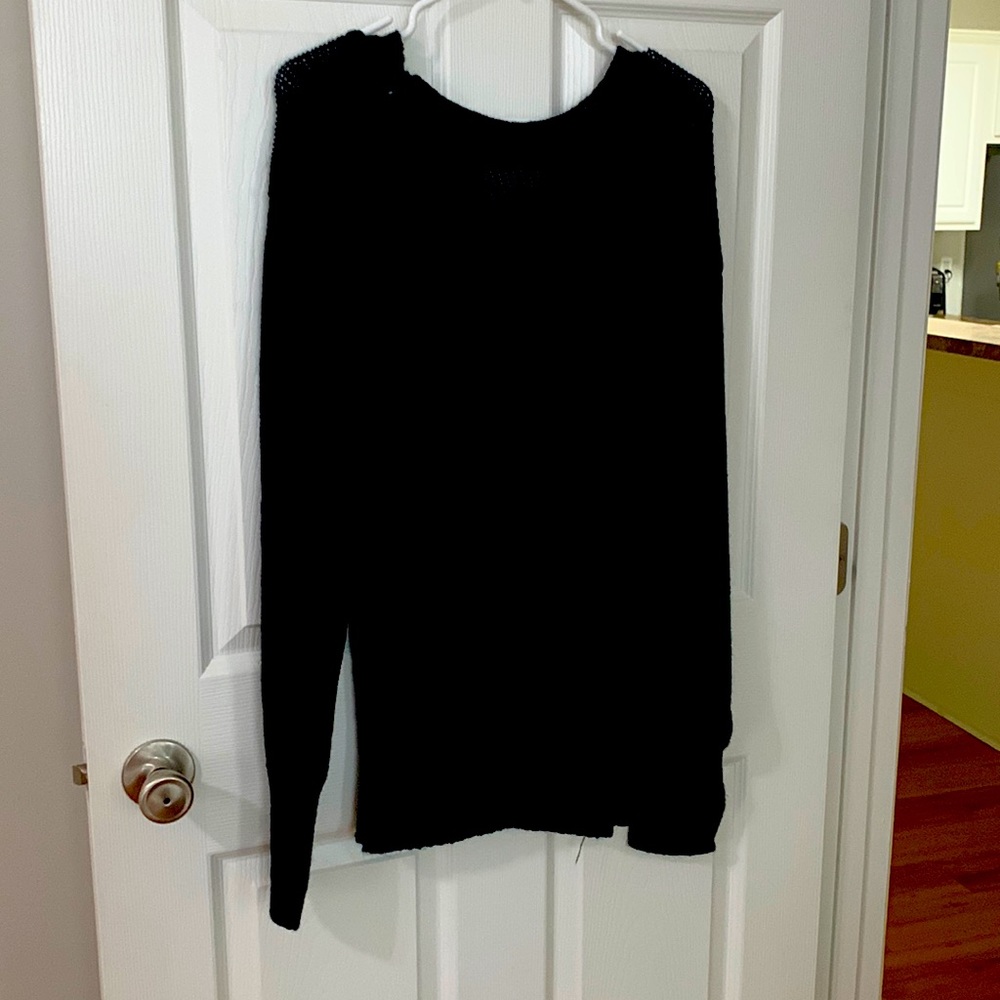 Backless sweater. Ties on the neck